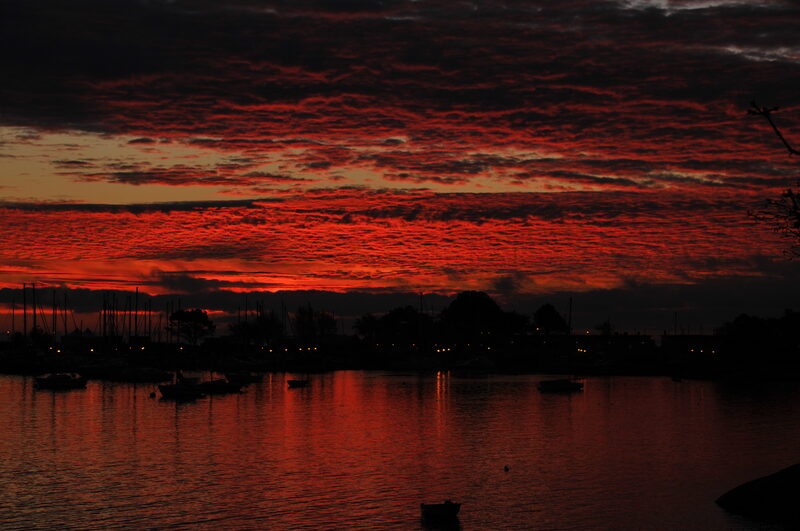 Crimson mackerel sky over marina